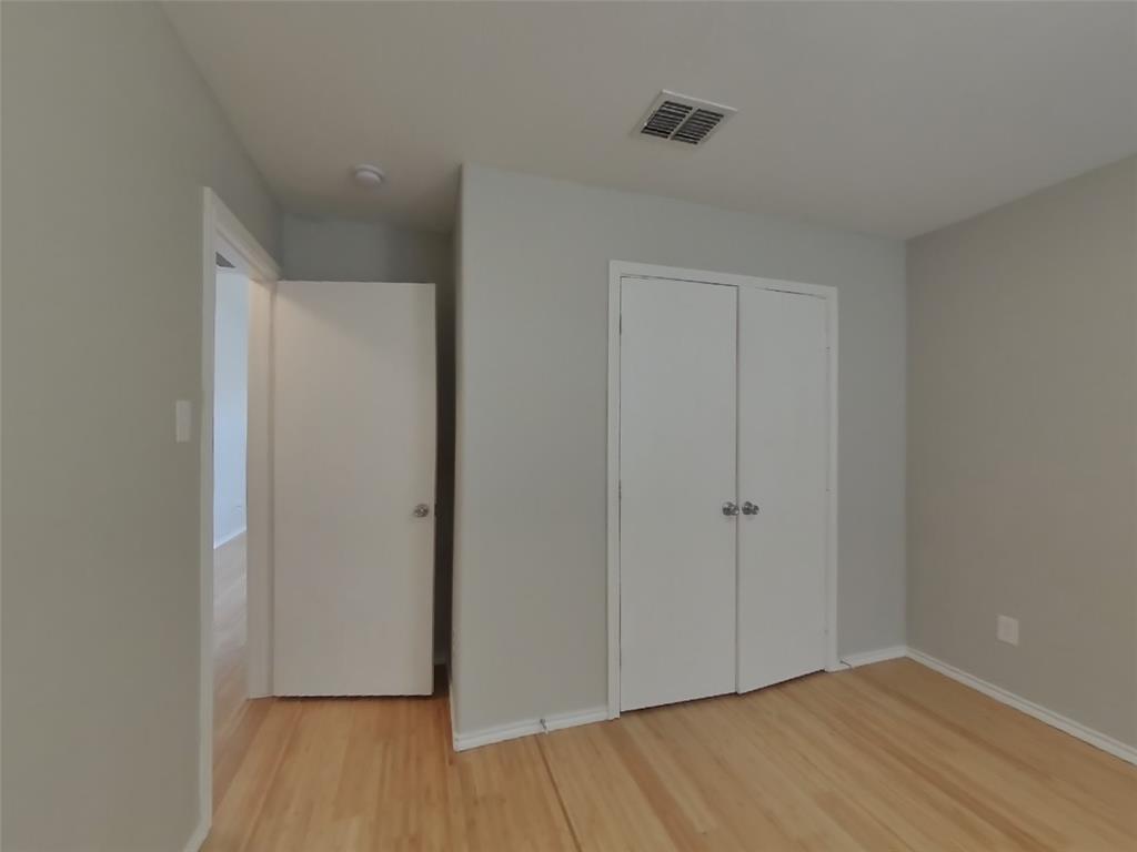 216 Rambling Way Forney, TX 75126 - Photo 10 of 22 a view of an empty room with wooden floor and closet