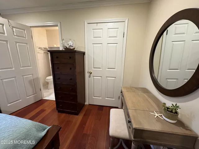 a view of a livingroom with furniture and wooden floor