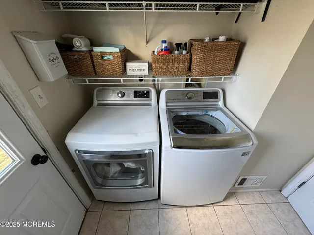 a utility room with washer and dryer