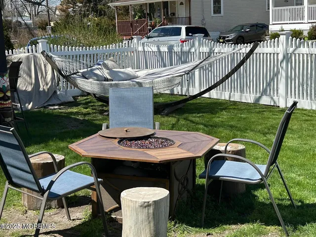 a view of a patio with a table and chairs