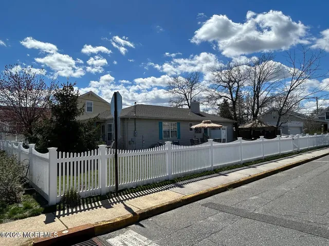 a view of a house with a street