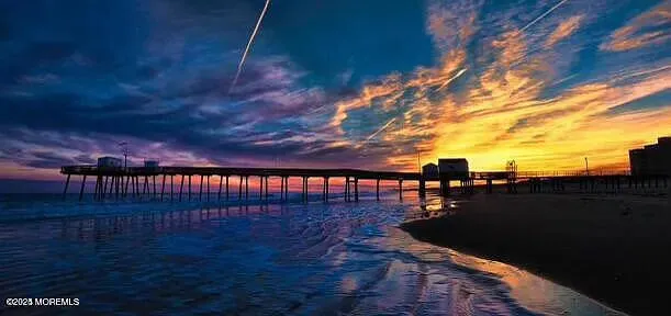 a view of swimming pool with furniture