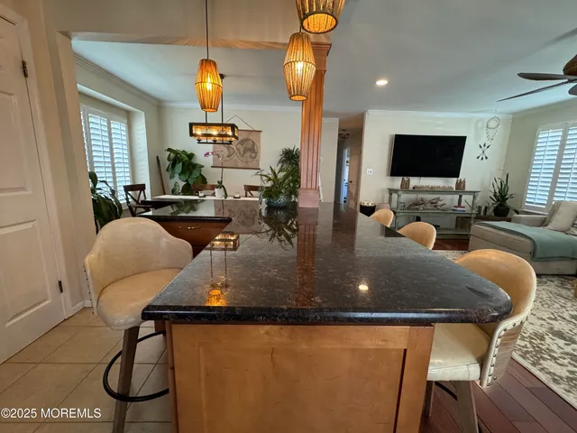 a living room with dining table and a couch