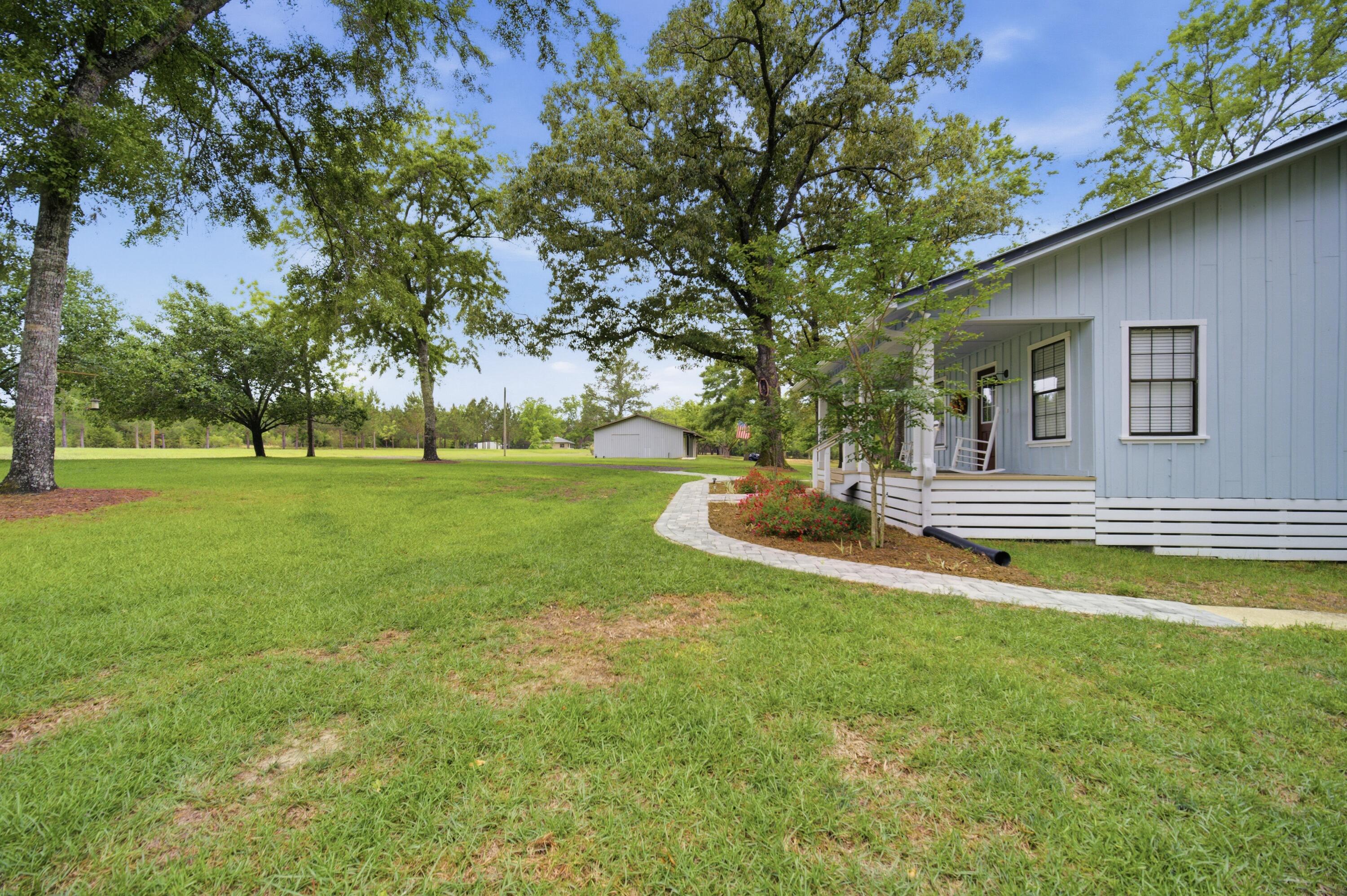 261 Wilkerson Road DeFuniak Springs, FL 32433 - Photo 47 of 76 a view of a house with a big yard
