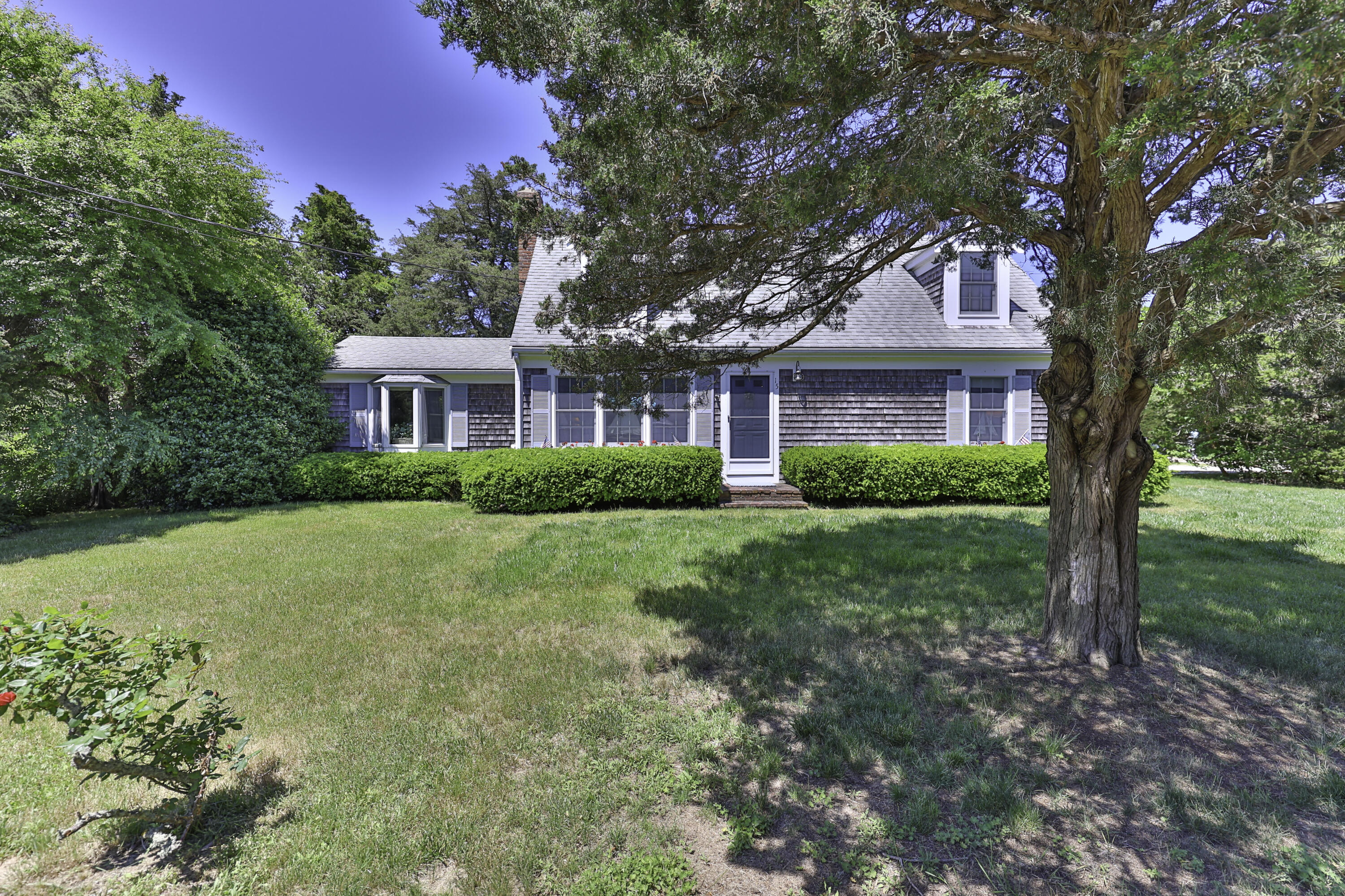 15 Doane Way Orleans, MA 02653 - Photo 1 of 54 a house view with a garden space