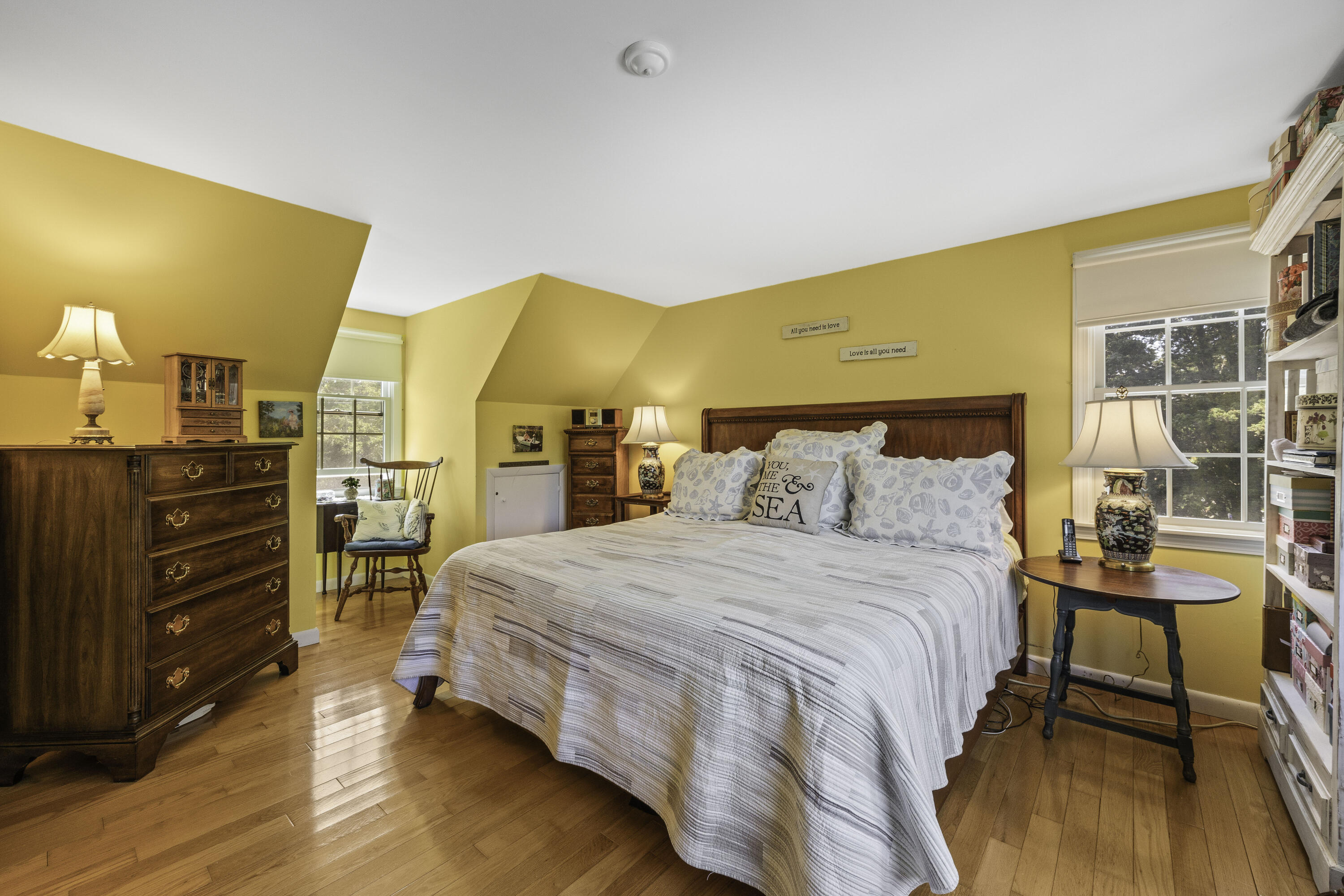 15 Doane Way Orleans, MA 02653 - Photo 21 of 54 a bedroom with a bed and wooden floor