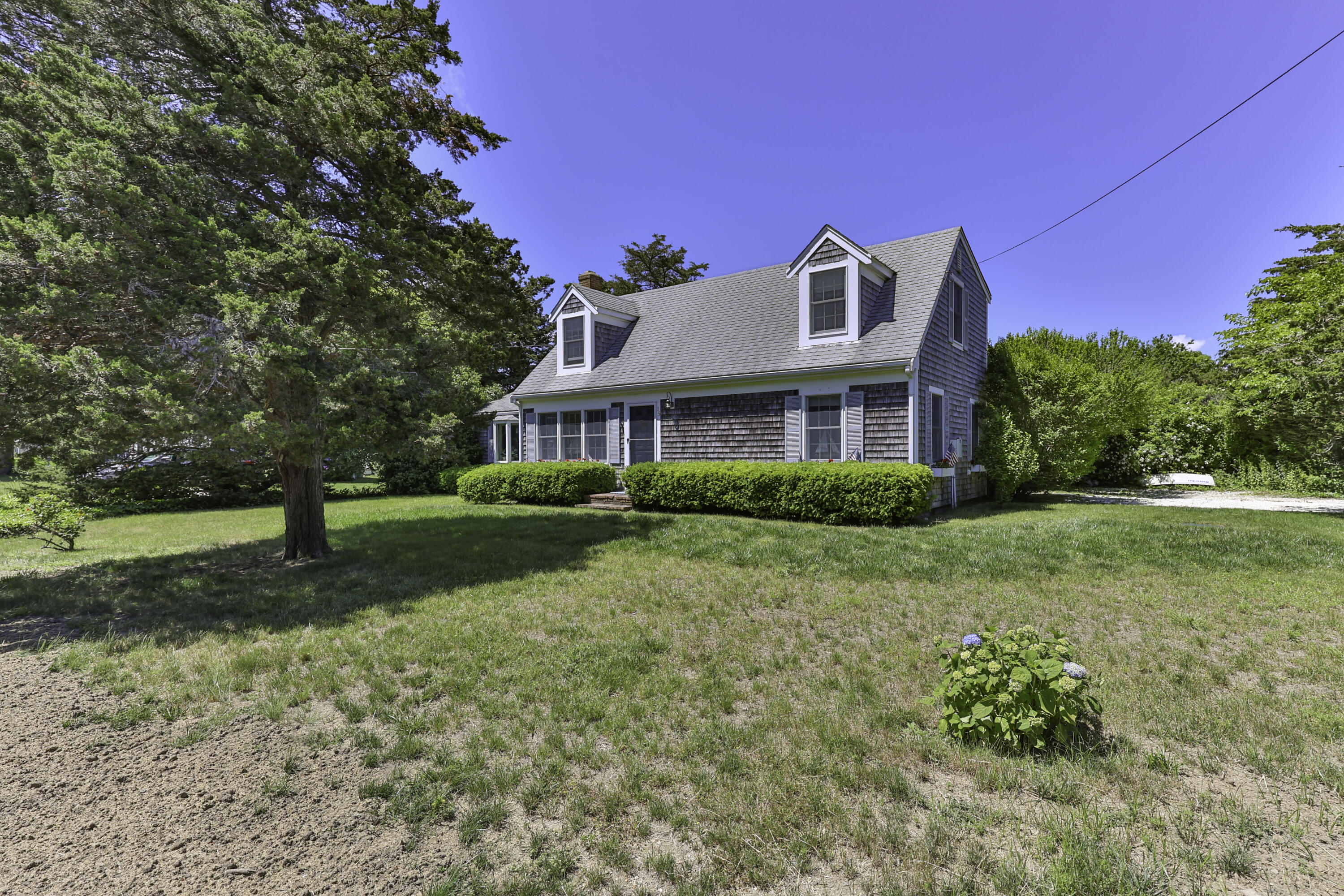 15 Doane Way Orleans, MA 02653 - Photo 25 of 54 a front view of a house with a yard