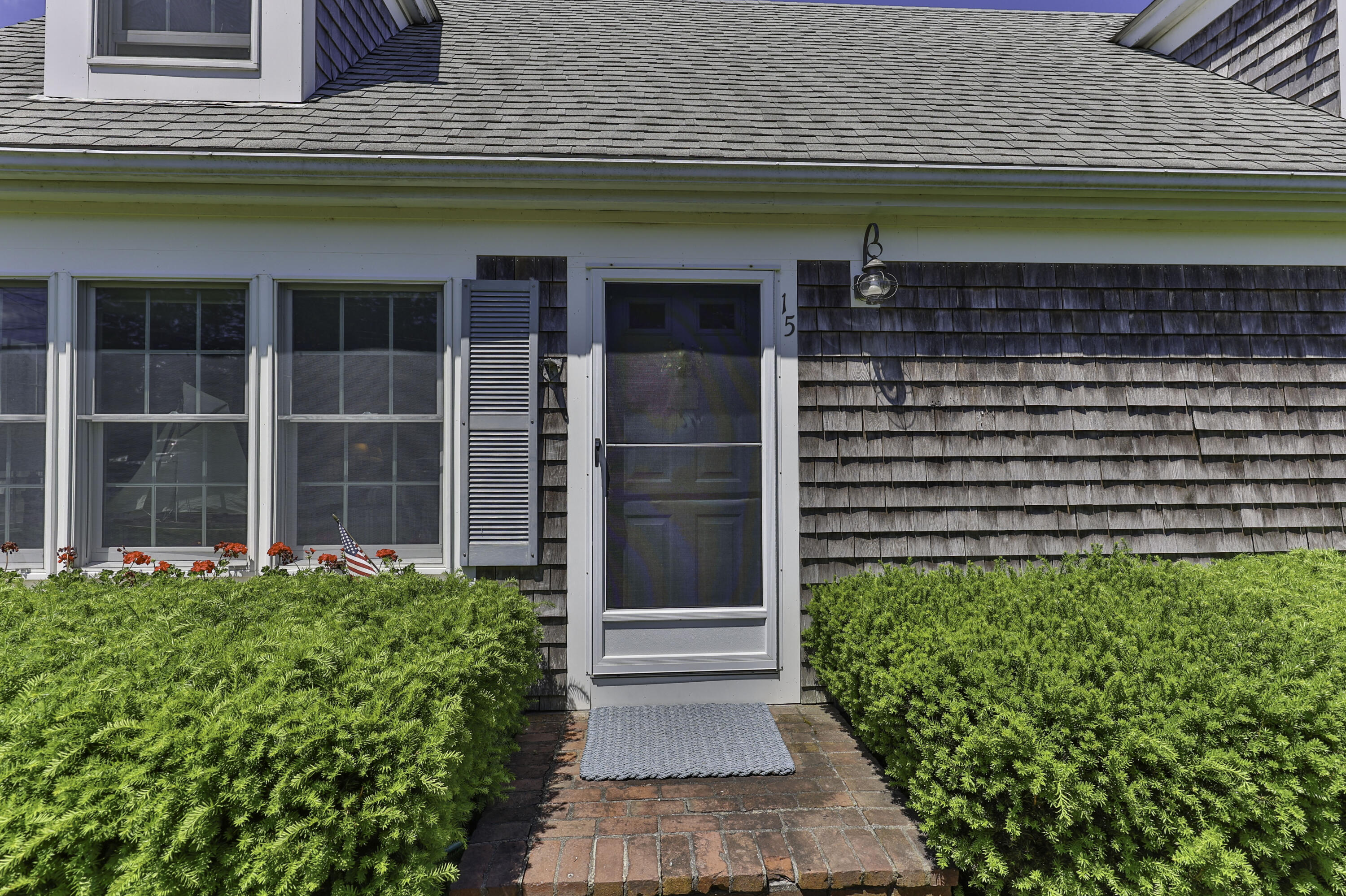 15 Doane Way Orleans, MA 02653 - Photo 26 of 54 a view of front door and flowers