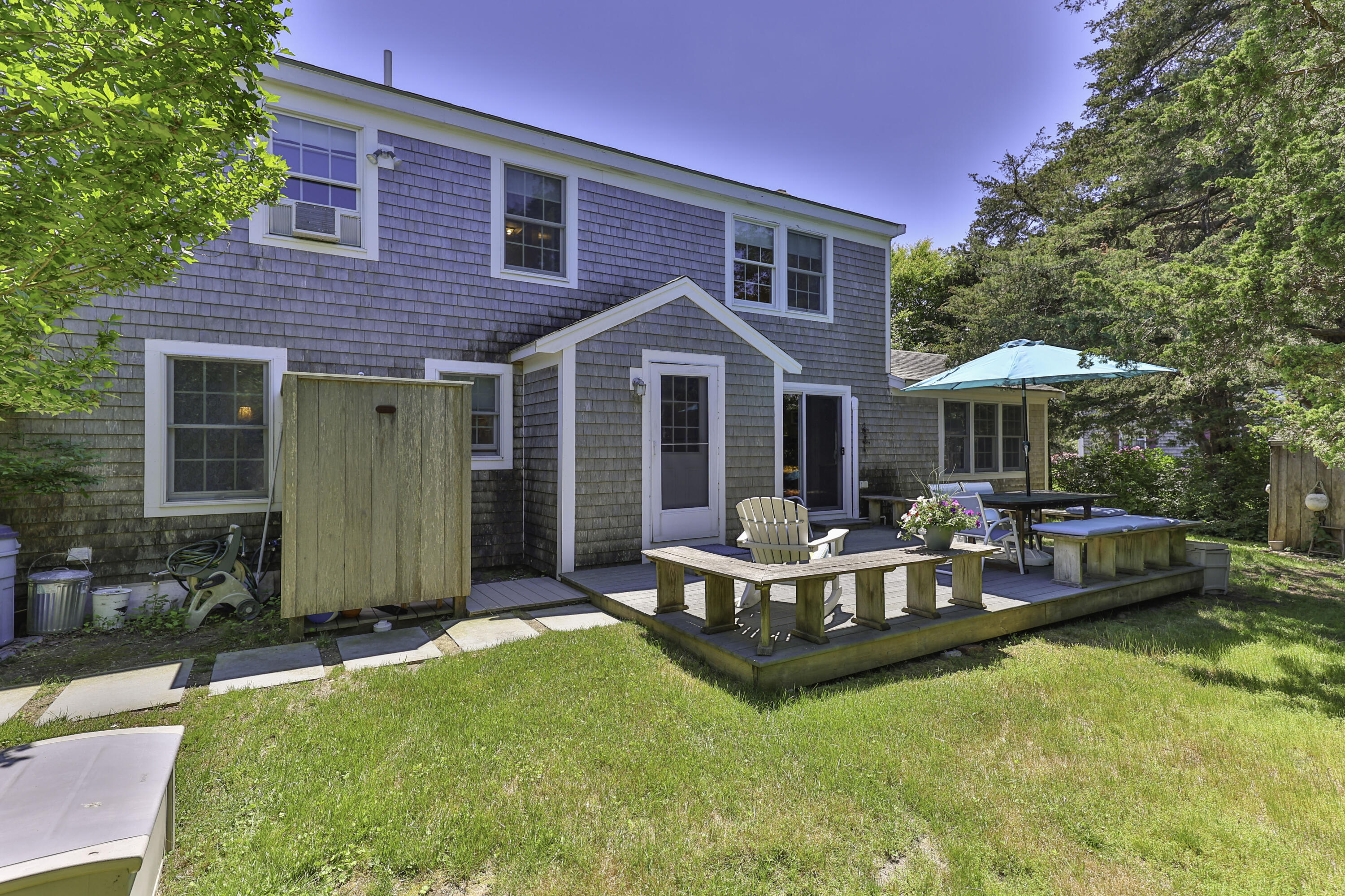 15 Doane Way Orleans, MA 02653 - Photo 27 of 54 a view of a house with swimming pool and porch with furniture