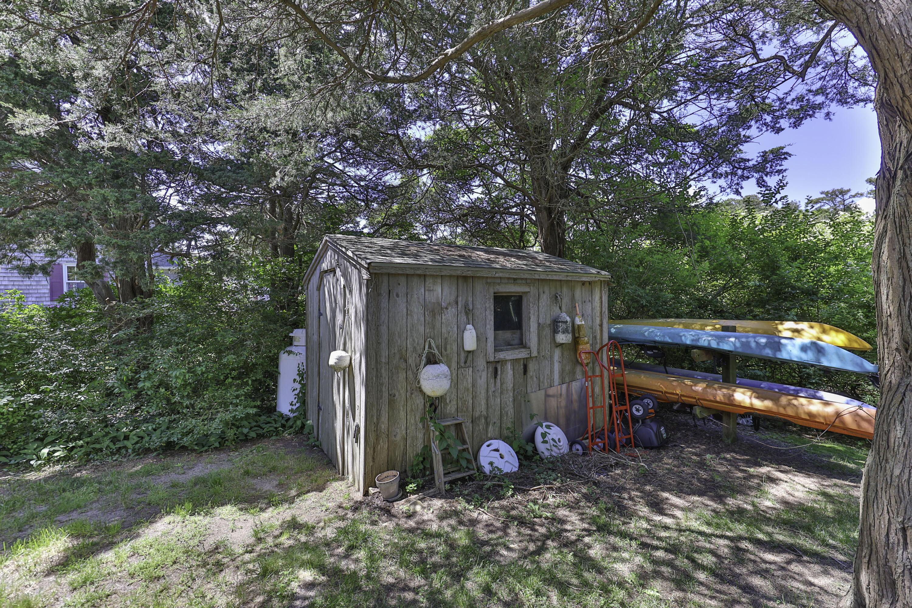 15 Doane Way Orleans, MA 02653 - Photo 31 of 54 a view of a barn in the middle of a yard