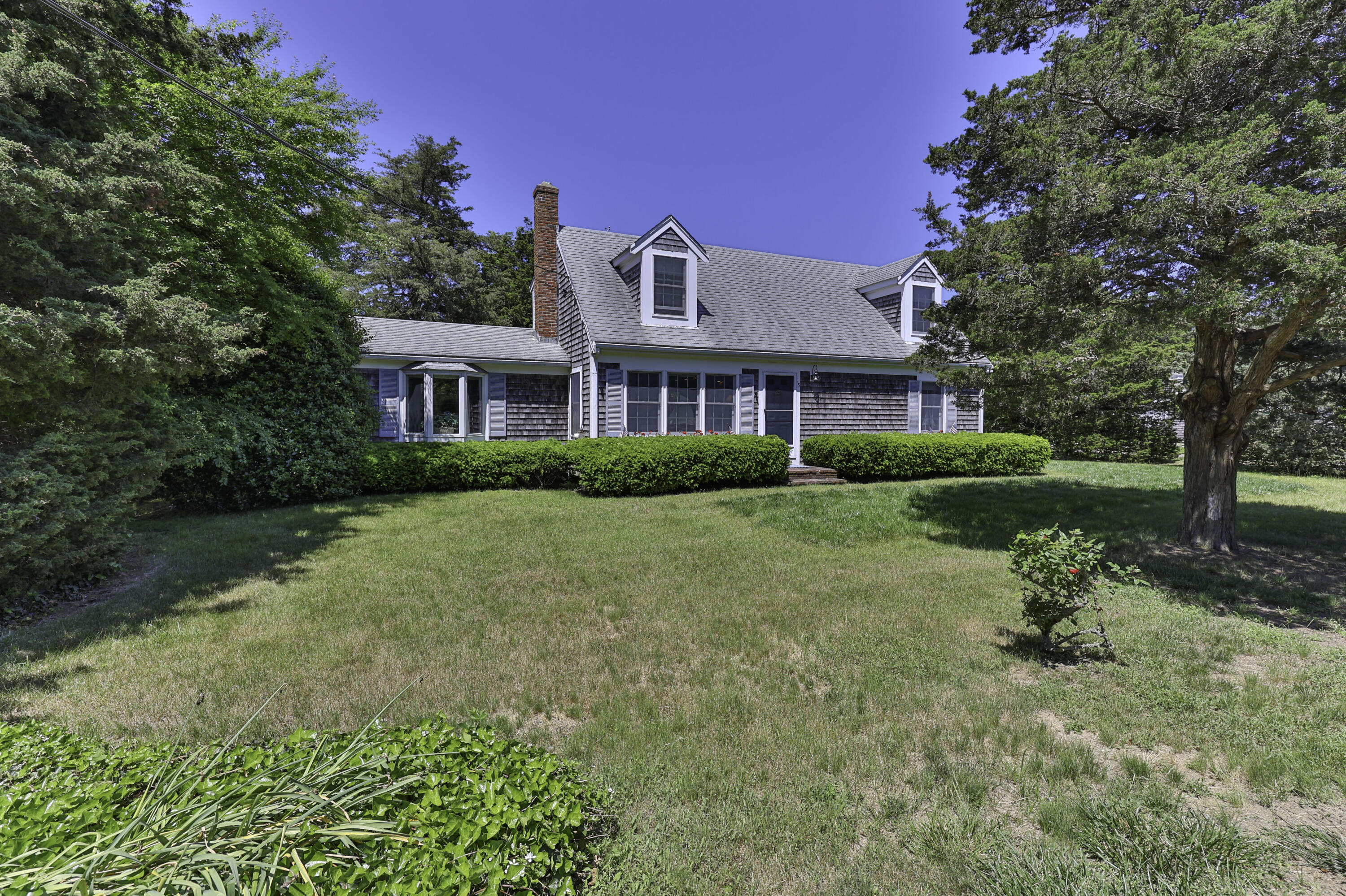 15 Doane Way Orleans, MA 02653 - Photo 35 of 54 a front view of a house with garden