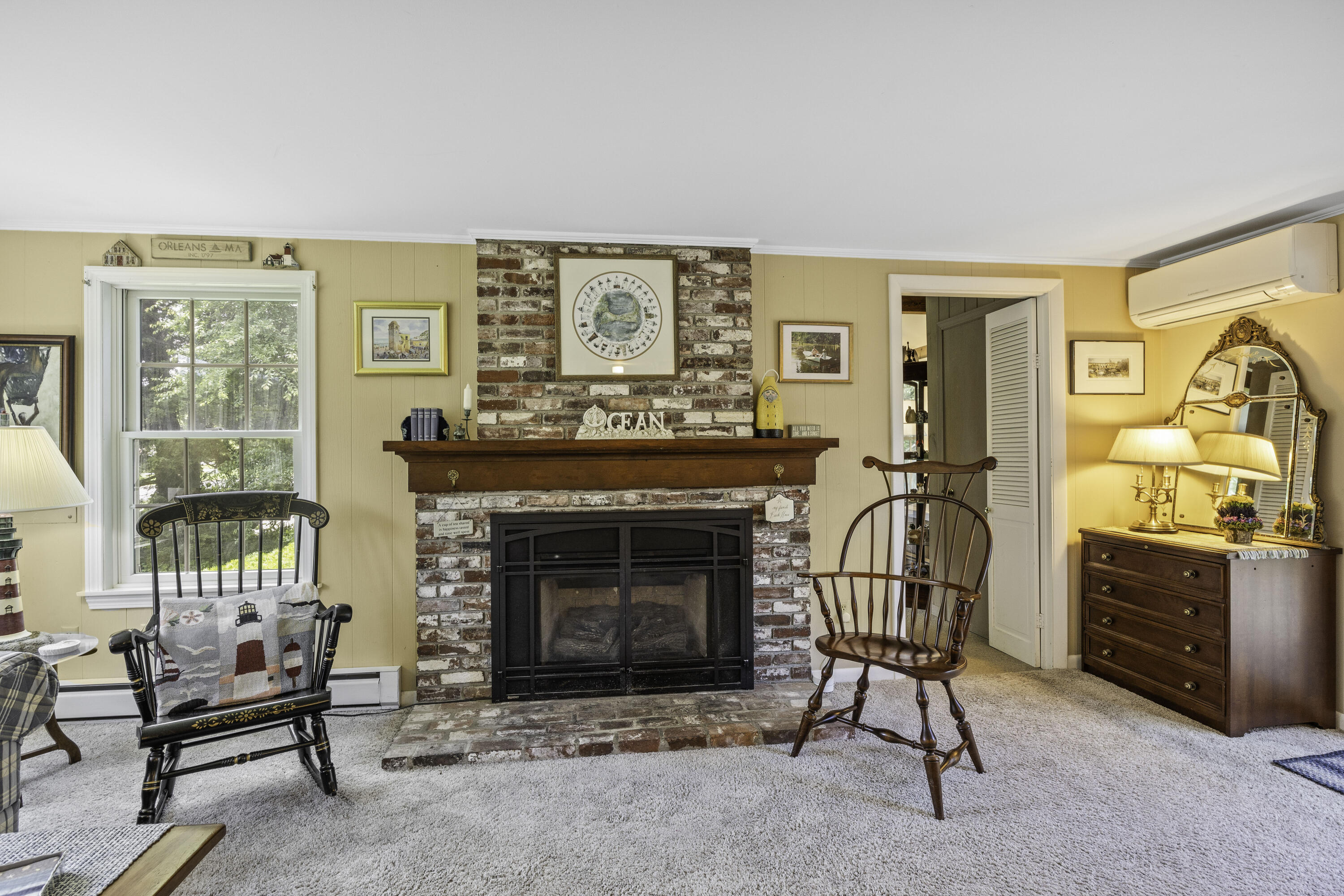15 Doane Way Orleans, MA 02653 - Photo 5 of 54 a living room with furniture a flat screen tv and a fireplace