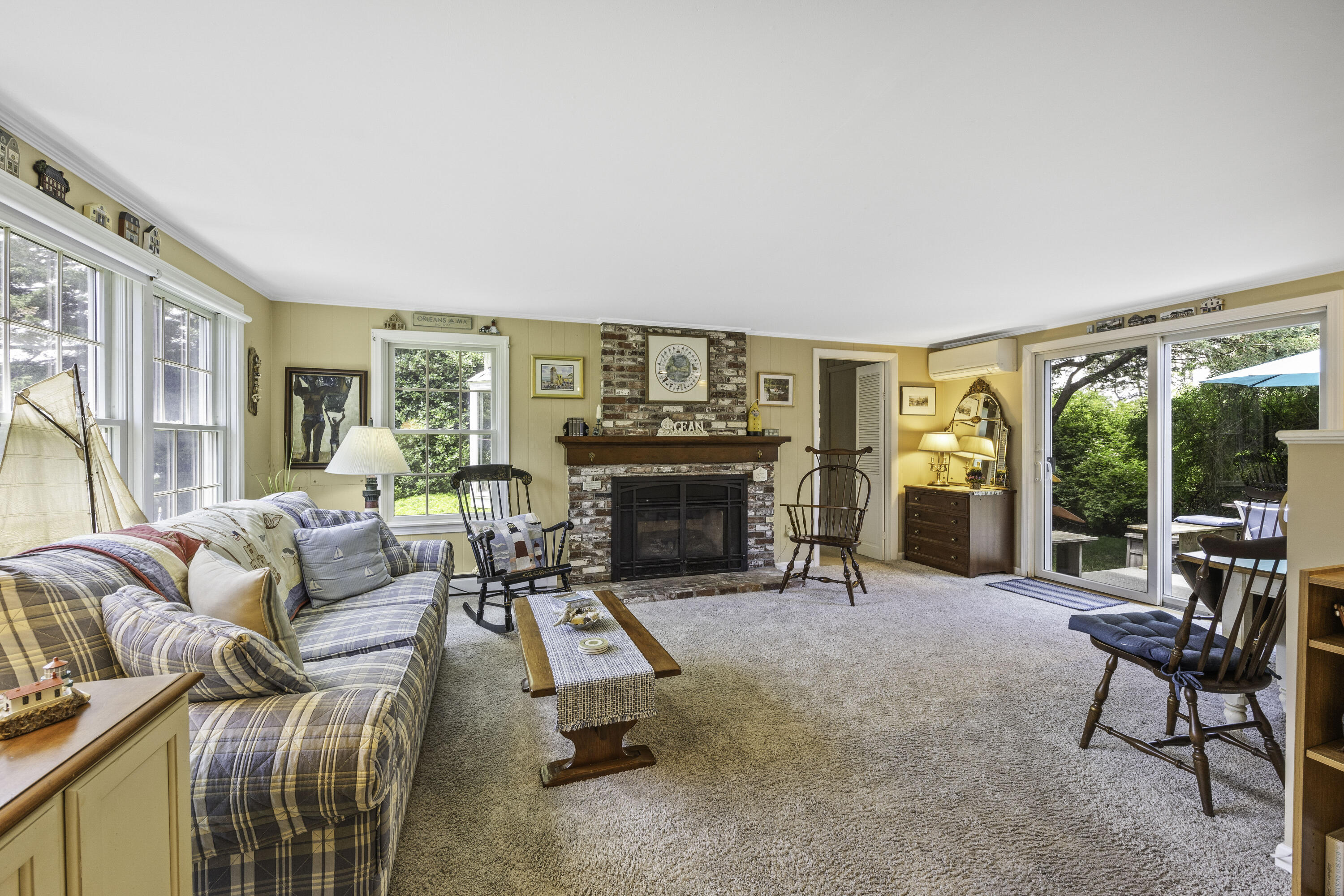 15 Doane Way Orleans, MA 02653 - Photo 7 of 54 a living room with furniture and a fireplace
