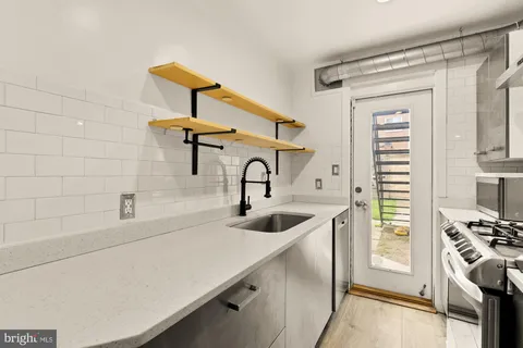 a bathroom with a sink and a washing machine