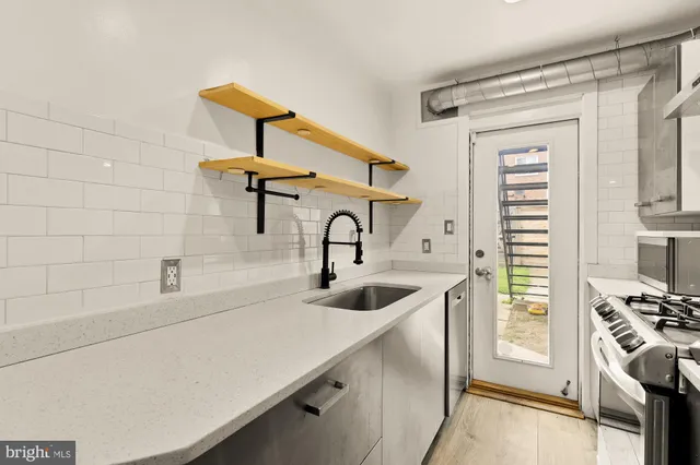 a bathroom with a sink and a washing machine