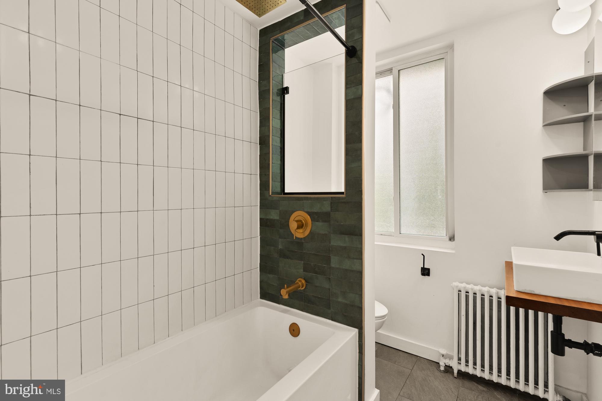 215 Hawaii Avenue Northeast Washington, DC 20011 - Photo 29 of 45 a bathroom with a bathtub