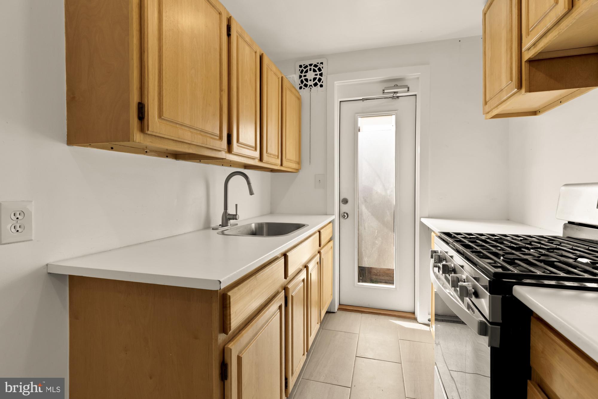 215 Hawaii Avenue Northeast Washington, DC 20011 - Photo 38 of 45 a kitchen that has a sink and a stove