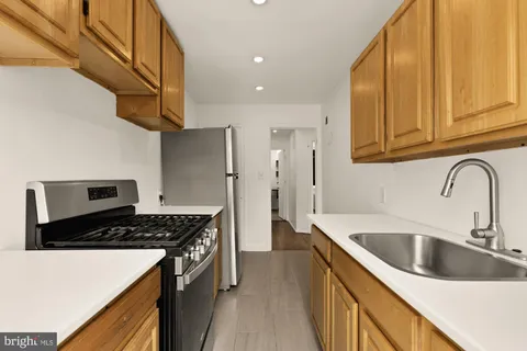 a kitchen that has a sink and a stove