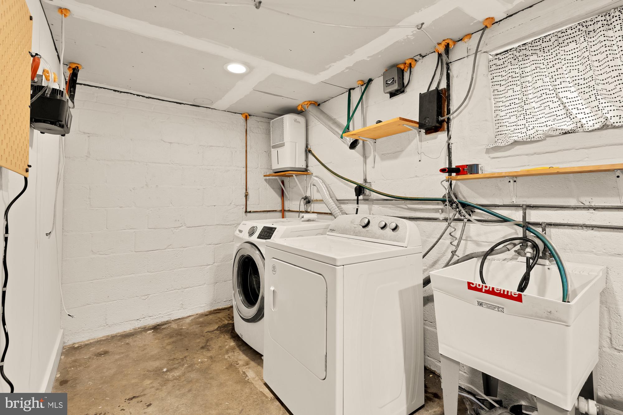 215 Hawaii Avenue Northeast Washington, DC 20011 - Photo 42 of 45 a utility room with dryer and washer
