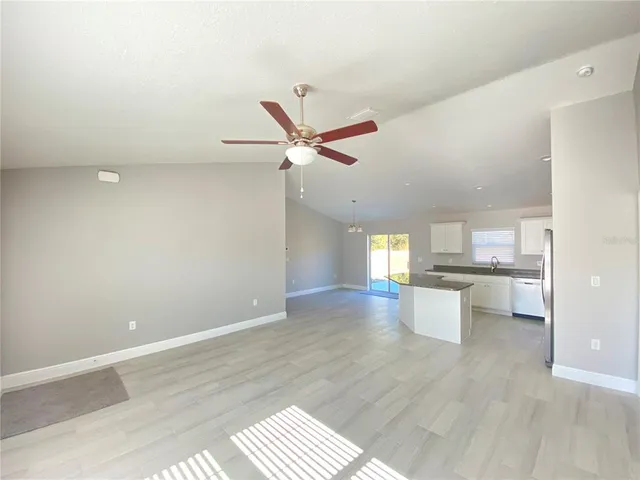 a view of a livingroom with a kitchen