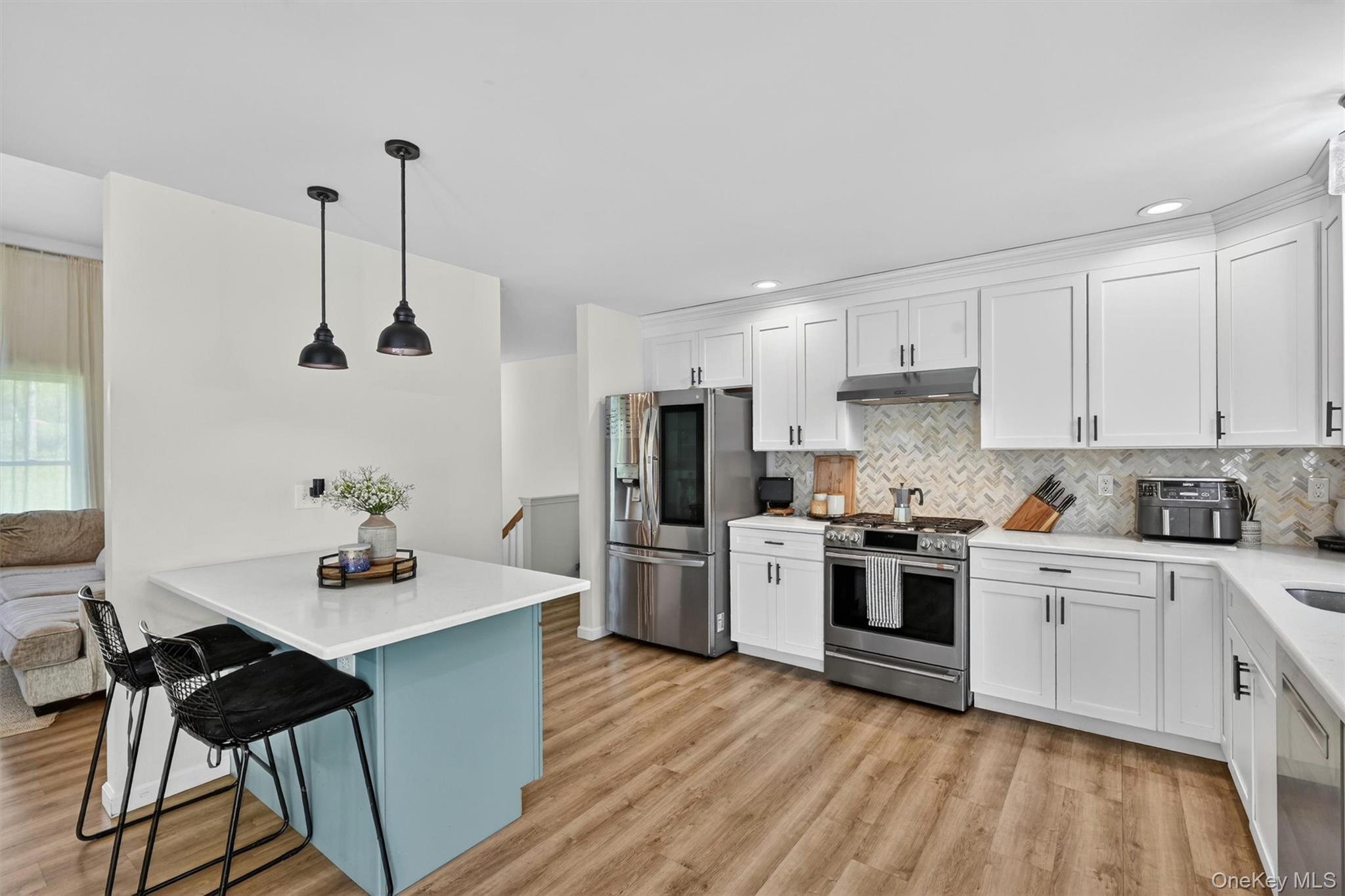 153 Ridge Drive Middletown, NY 10940 - Photo 15 of 47 a kitchen with a stove a sink and a refrigerator