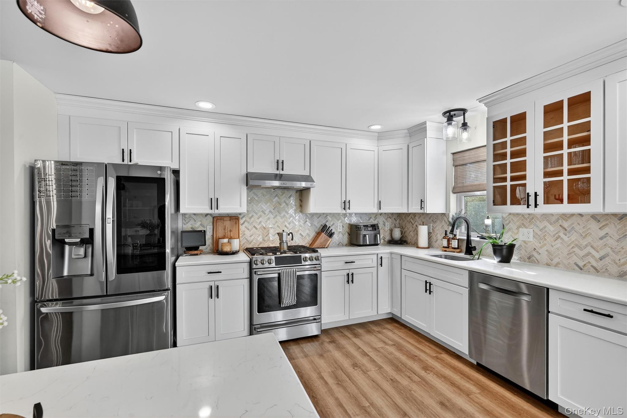 153 Ridge Drive Middletown, NY 10940 - Photo 19 of 47 a kitchen with a stove a sink and a refrigerator