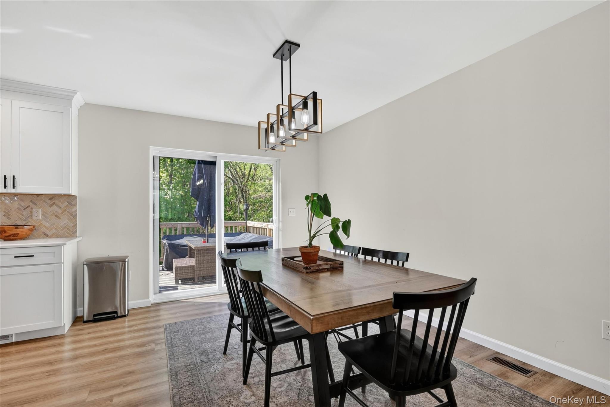 153 Ridge Drive Middletown, NY 10940 - Photo 20 of 47 a view of a dining room with furniture window and wooden floor