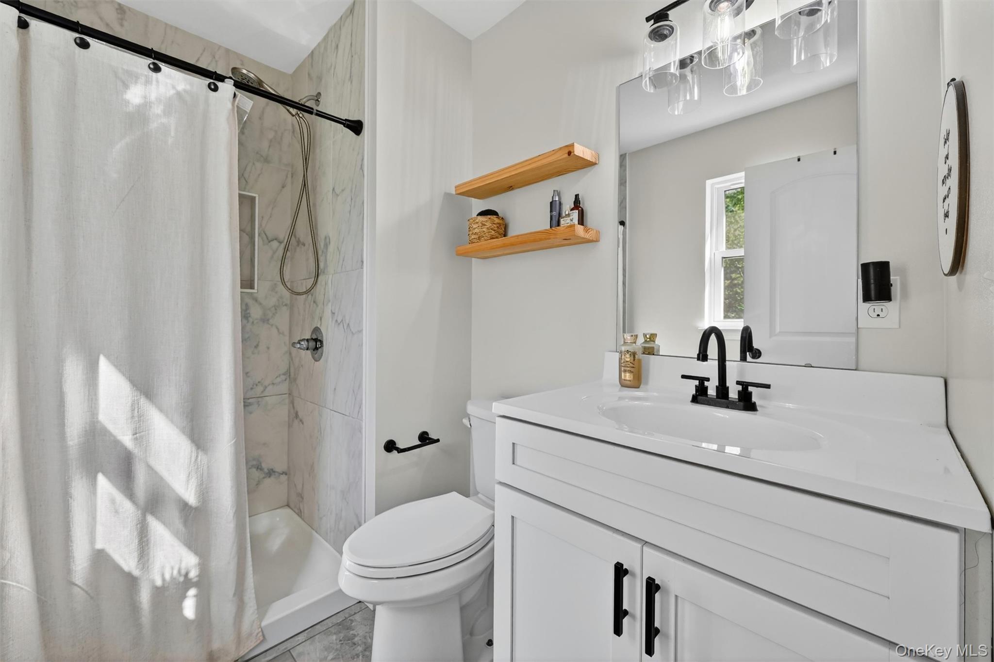 153 Ridge Drive Middletown, NY 10940 - Photo 28 of 47 a bathroom with a sink a toilet and shower