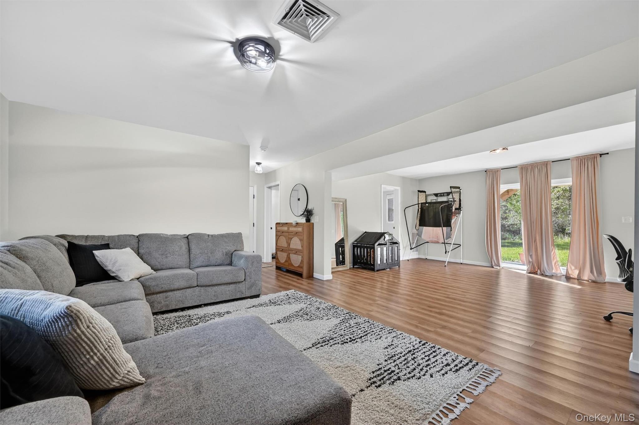 153 Ridge Drive Middletown, NY 10940 - Photo 36 of 47 a living room with furniture and wooden floor