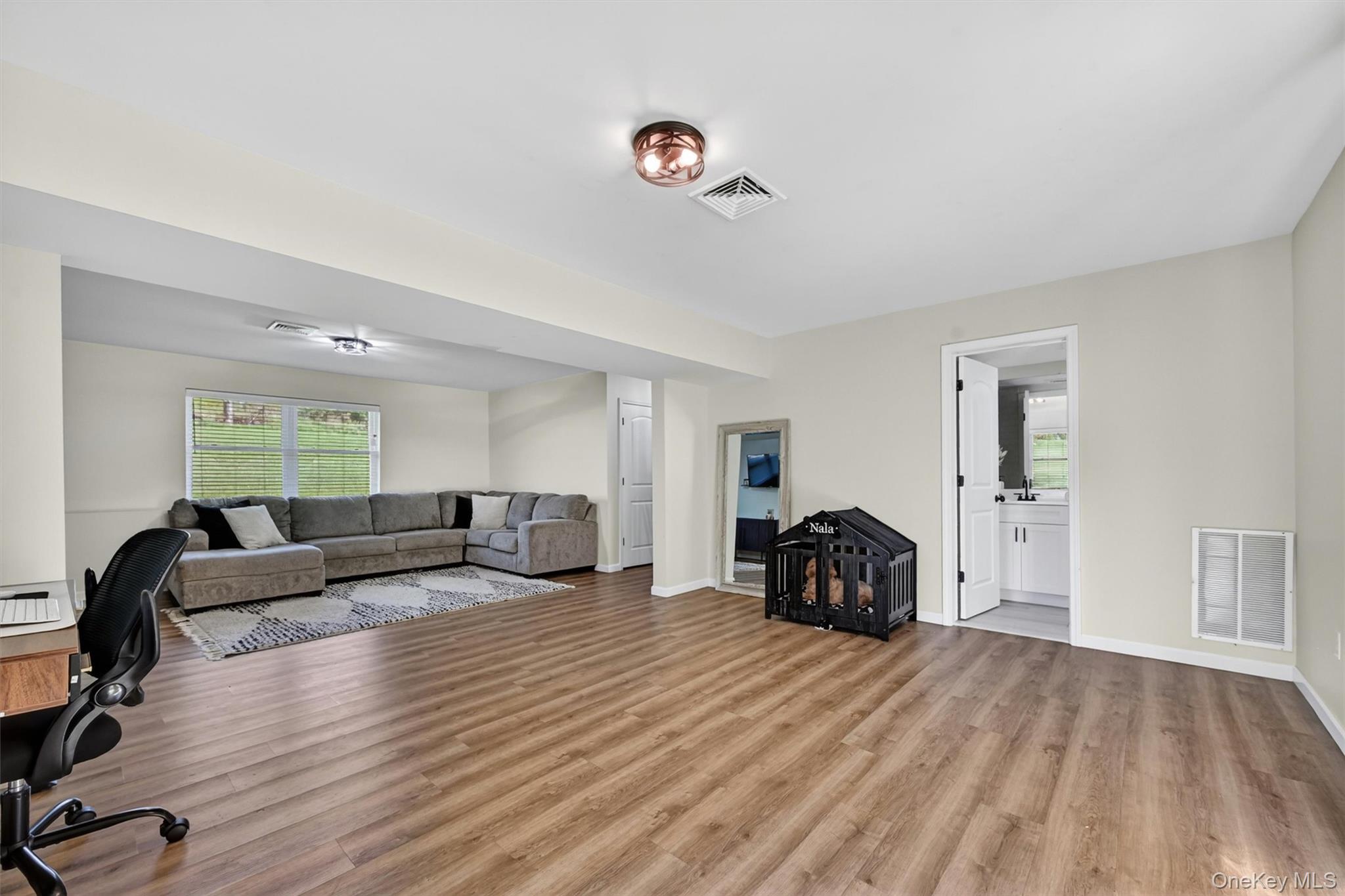 153 Ridge Drive Middletown, NY 10940 - Photo 39 of 47 a living room with furniture and a wooden floor