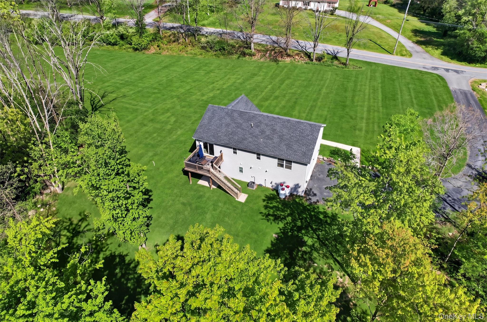 153 Ridge Drive Middletown, NY 10940 - Photo 5 of 47 an aerial view of a house with a yard