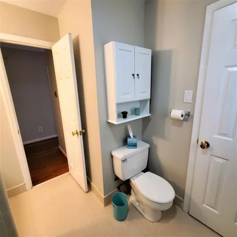 a bathroom with a toilet and a sink