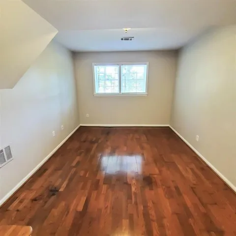 a view of an empty room with stairs