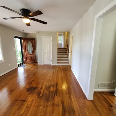 a view of entryway with wooden floor
