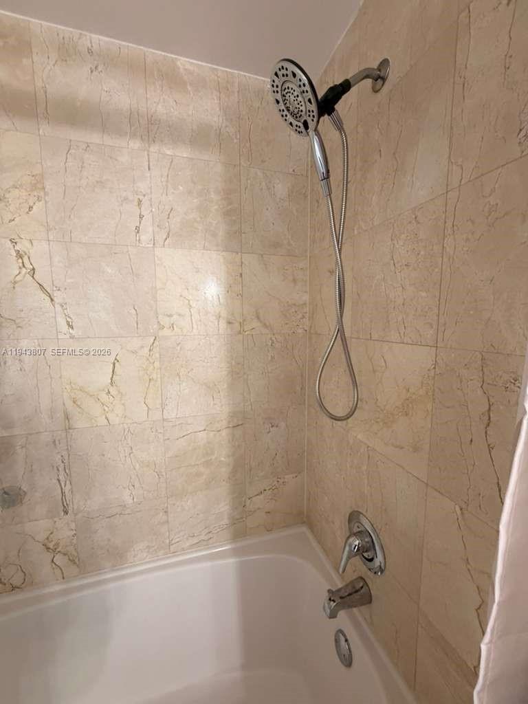 170 Southeast 14th Street, Unit 1807 Miami, FL 33131 - Photo 10 of 11 a bathroom with a shower