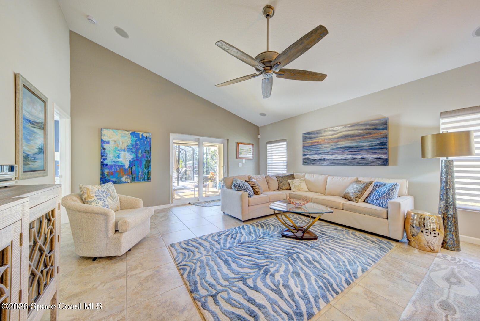 2975 Louetta Circle Melbourne, FL 32901 - Photo 13 of 44 a living room with furniture and a large window