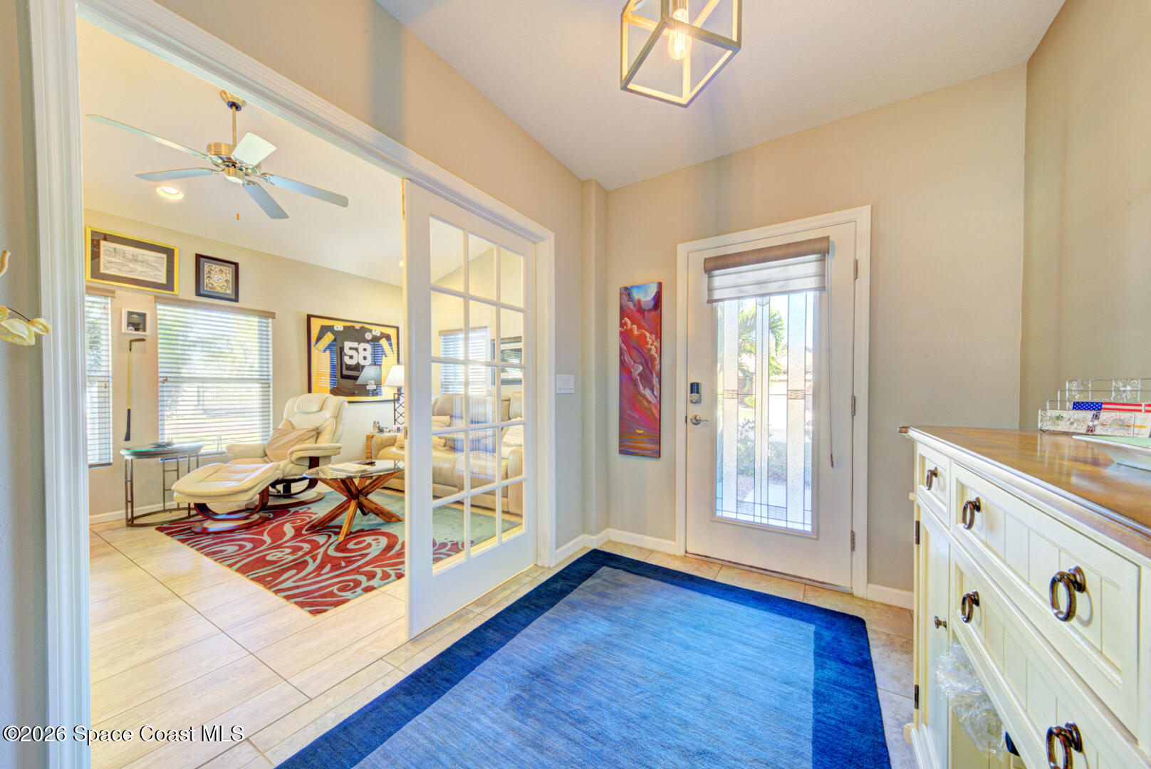 2975 Louetta Circle Melbourne, FL 32901 - Photo 2 of 44 a view of a bedroom with wooden floor and windows