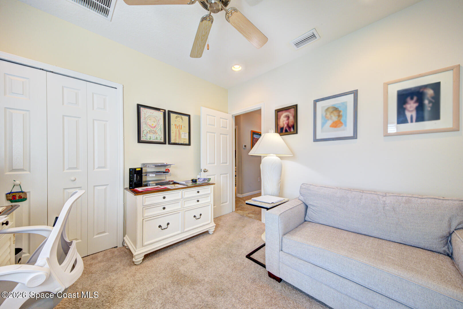 2975 Louetta Circle Melbourne, FL 32901 - Photo 30 of 44 a living room with furniture and painting on the wall