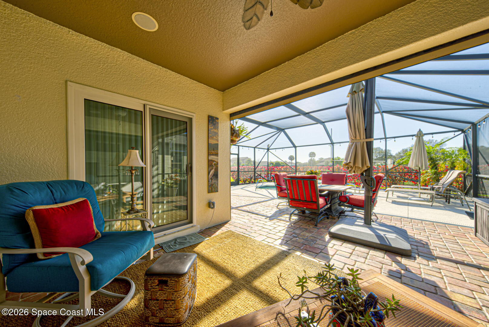 2975 Louetta Circle Melbourne, FL 32901 - Photo 35 of 44 a living room with furniture and a floor to ceiling window