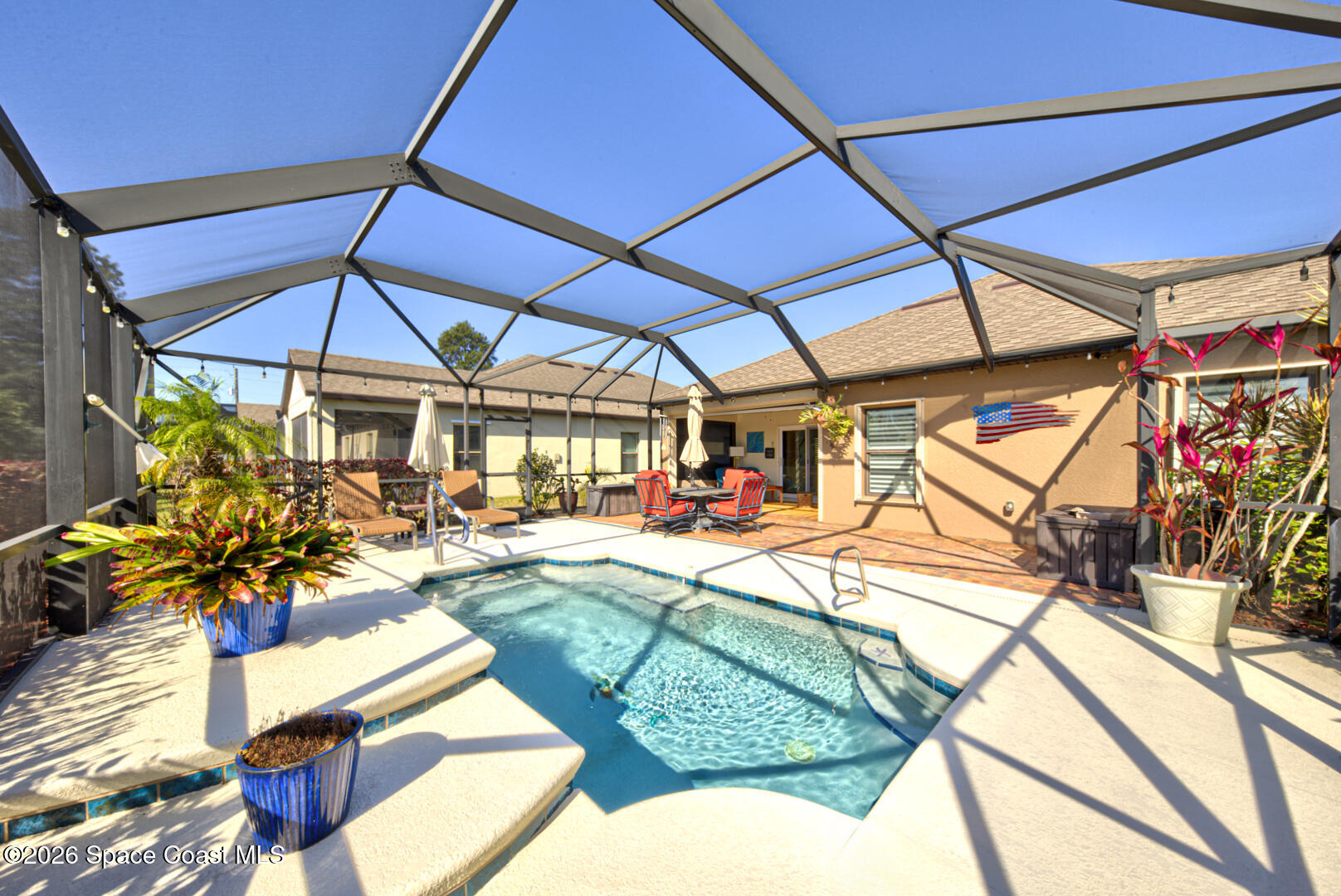 2975 Louetta Circle Melbourne, FL 32901 - Photo 38 of 44 a view of a backyard with a patio and dining space