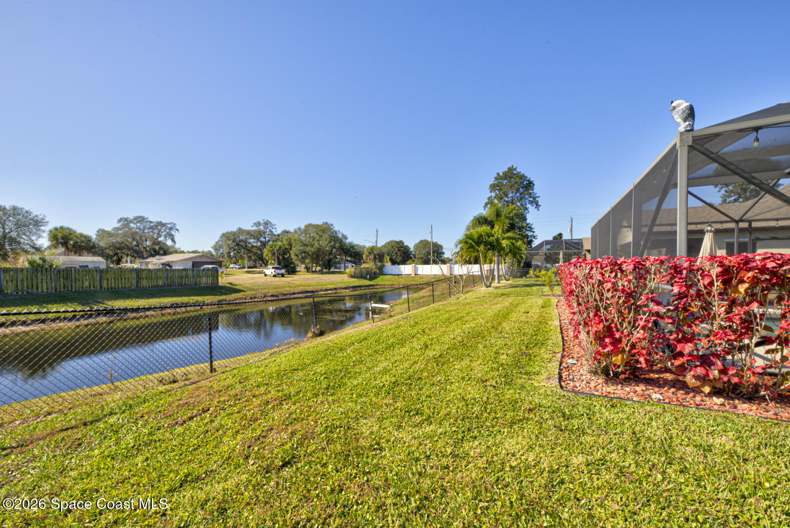 2975 Louetta Circle Melbourne, FL 32901 - Photo 43 of 44 a view of a lake with a house in the background