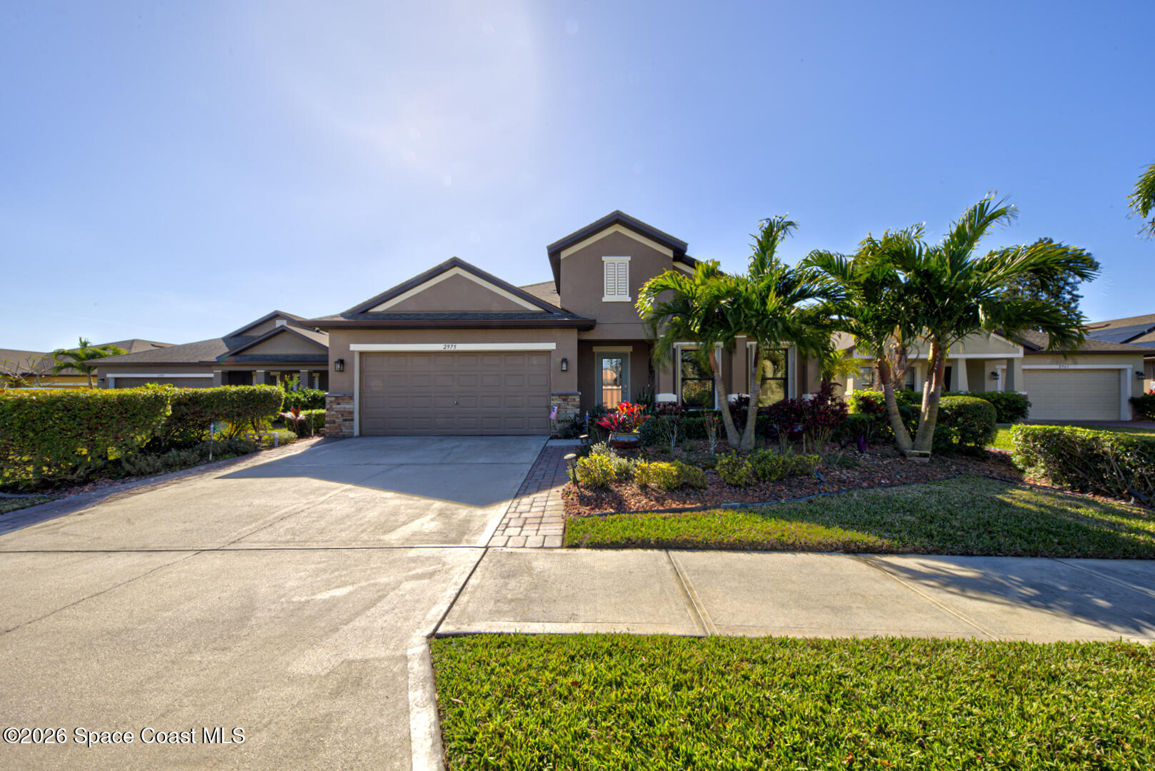 2975 Louetta Circle Melbourne, FL 32901 - Photo 44 of 44 a front view of a house with a garden and plants