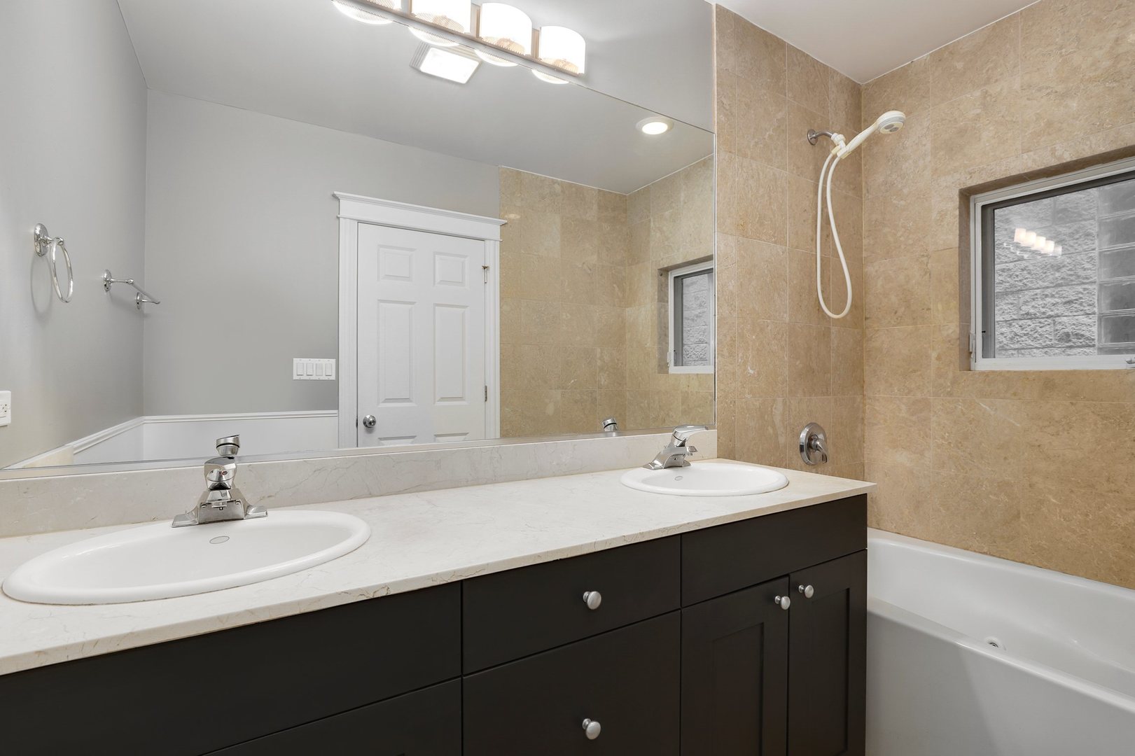 3211 North Racine Avenue, Unit 2 Chicago, IL 60657 - Photo 18 of 22 a bathroom with a double vanity sink mirror and double