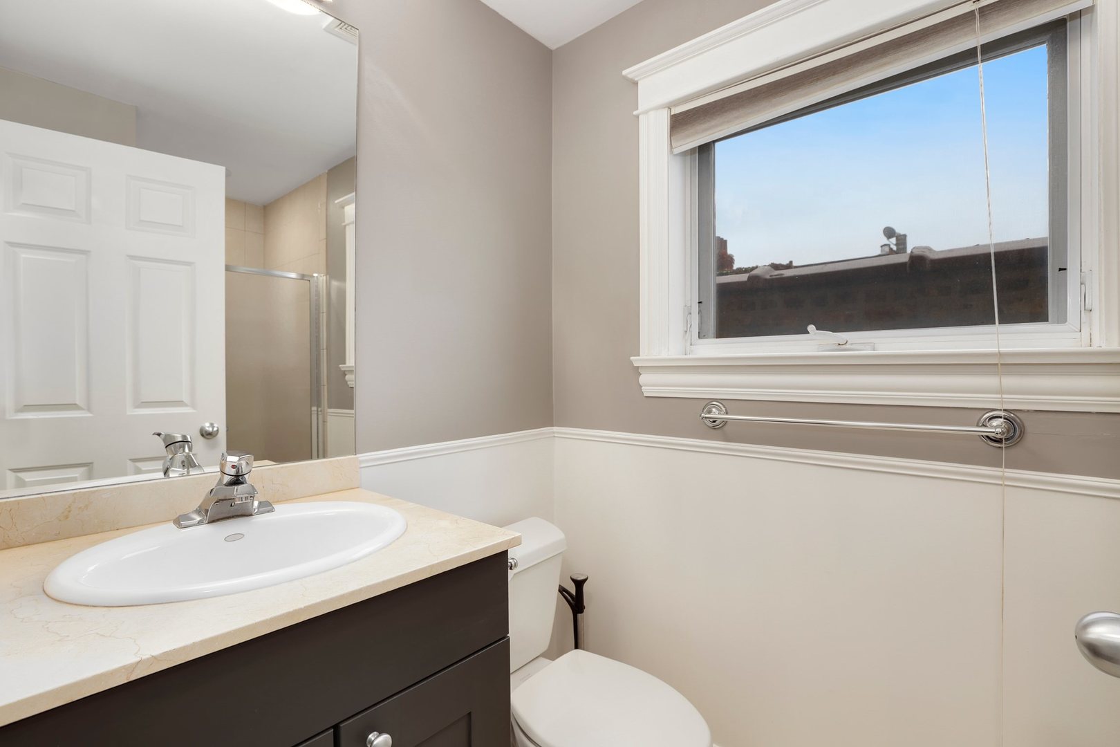 3211 North Racine Avenue, Unit 2 Chicago, IL 60657 - Photo 19 of 22 a bathroom with a sink and a toilet