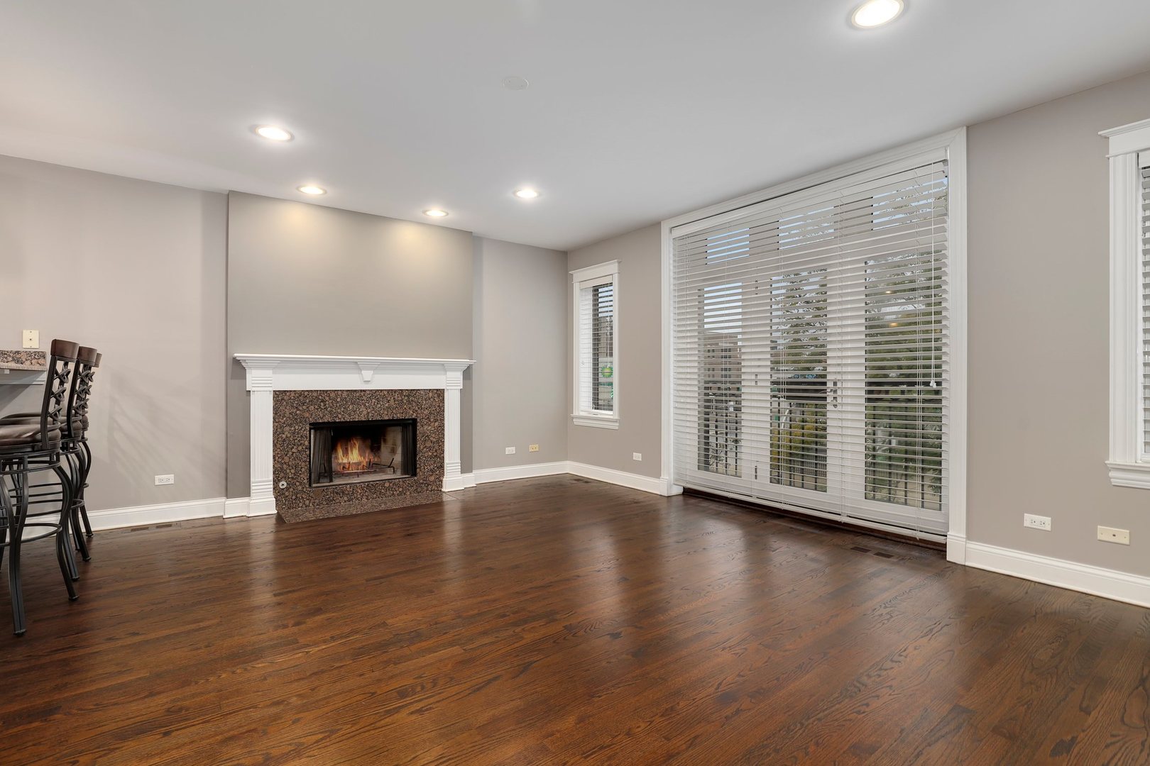 3211 North Racine Avenue, Unit 2 Chicago, IL 60657 - Photo 3 of 22 a view of an empty room with wooden floor and a window