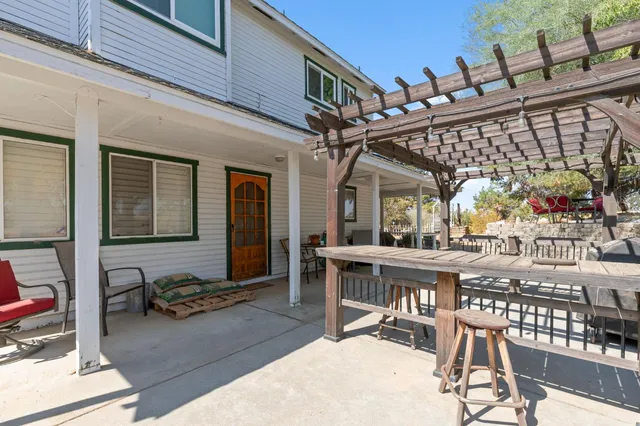 a view of a chairs and table in a patio