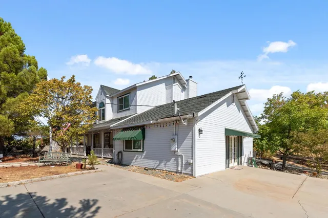 a view of a building with trees in the background