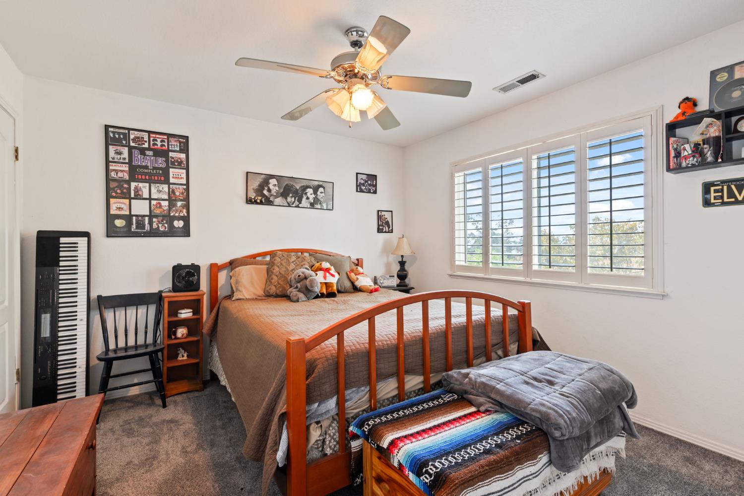 35670 Road 603 Raymond, CA 93653 - Photo 36 of 61 a bedroom with a bed and a chandelier
