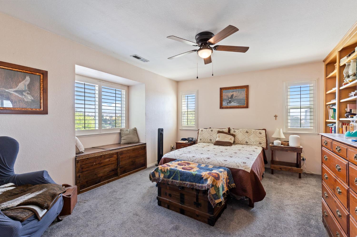 35670 Road 603 Raymond, CA 93653 - Photo 37 of 61 a bedroom with a bed and a chandelier