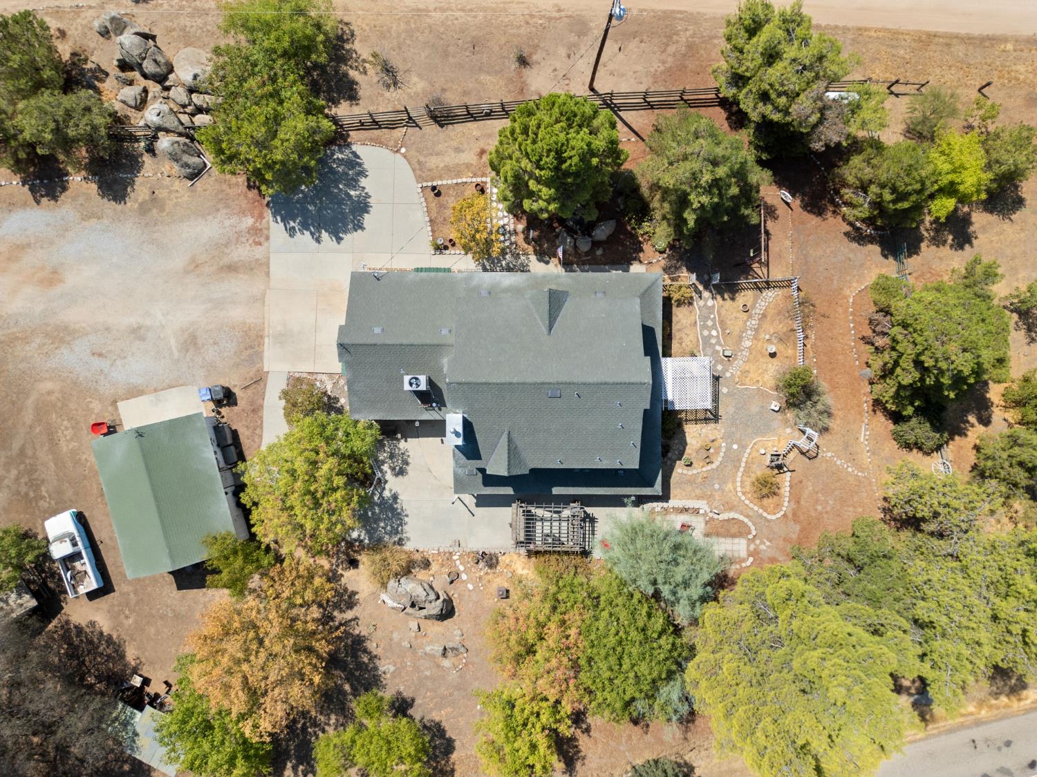 35670 Road 603 Raymond, CA 93653 - Photo 60 of 61 an aerial view of a house with a yard and trees in the back